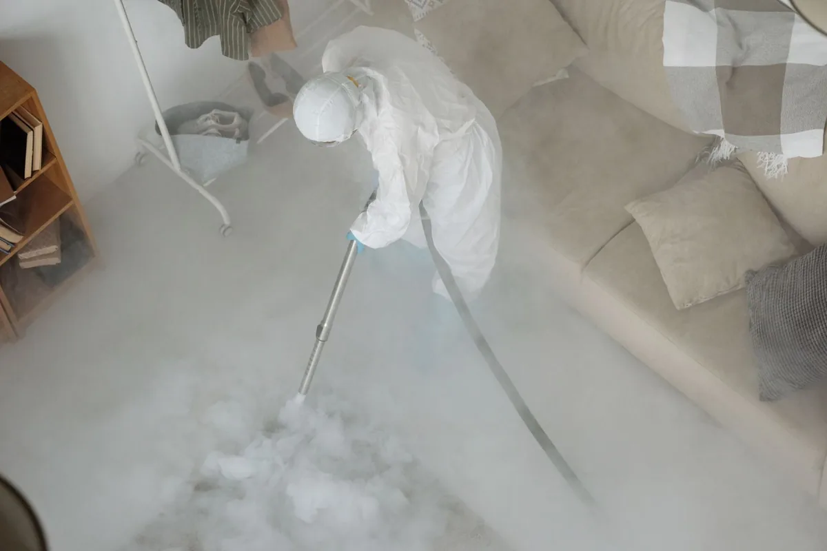 Biohazard cleanup technician in protective equipment, Virginia Beach, VA